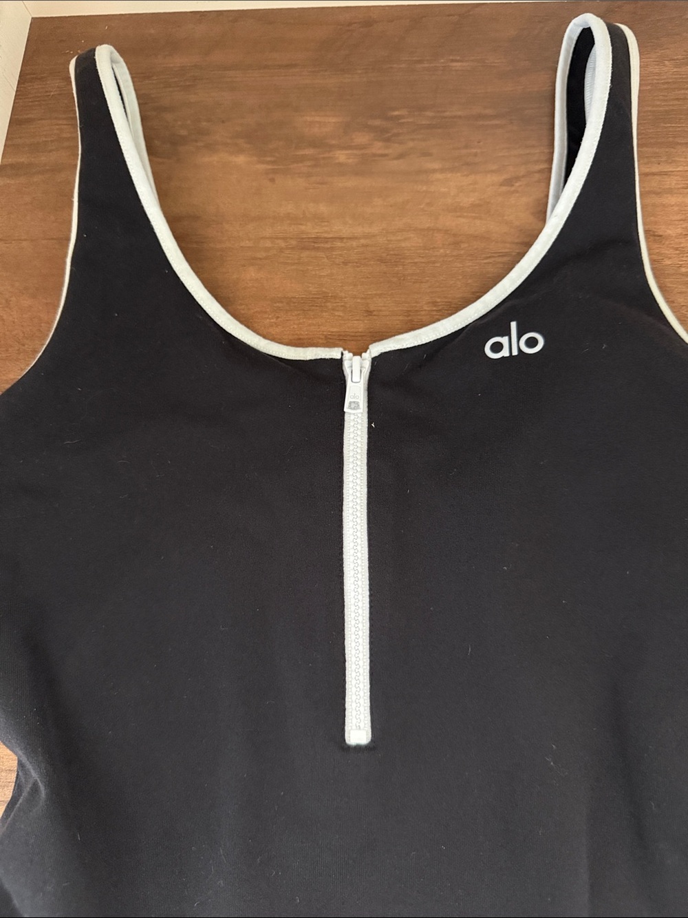ALO Yoga Black Sleeveless Bodysuit with White Zip Trim